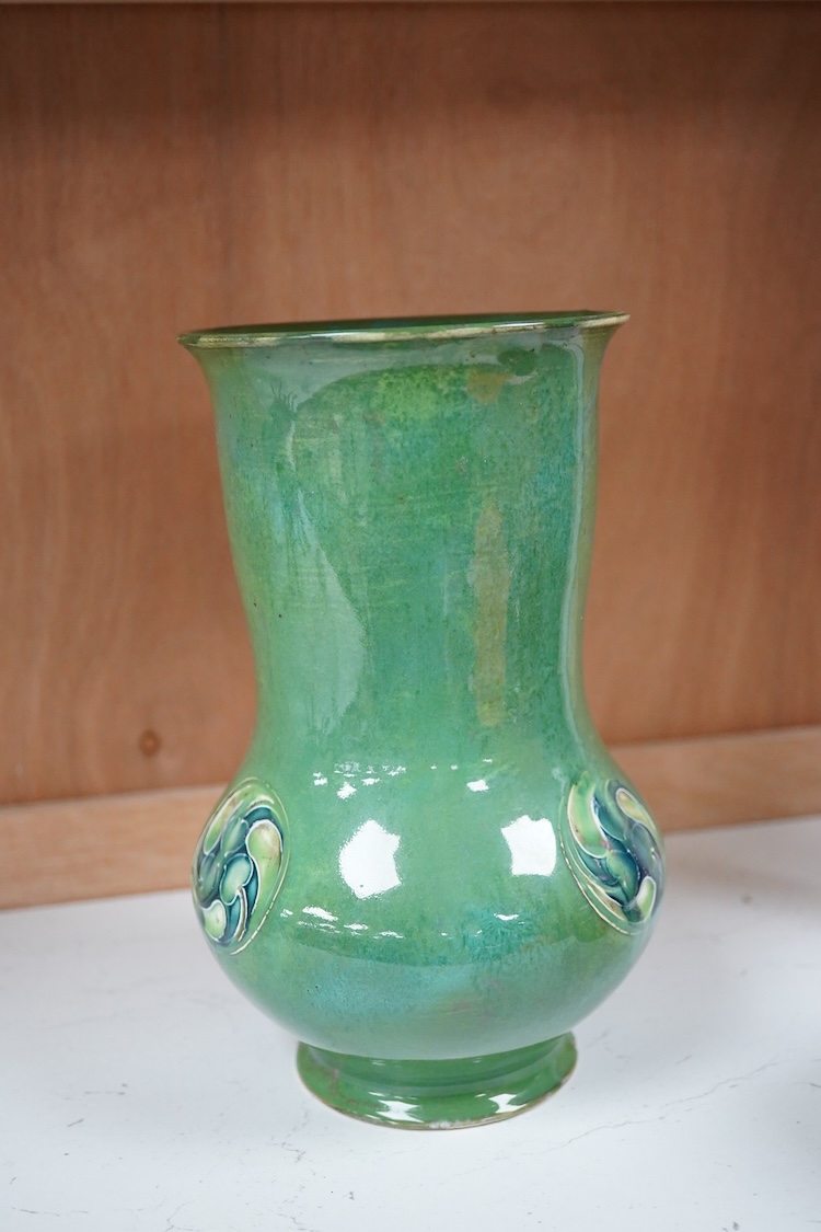 A Moorcroft for Liberty & Co. Flamminion Ware vase, and a smaller Moorcroft vase glazed in a mottled plum flambe, the first 20cm., also to include two Moorcroft reference books